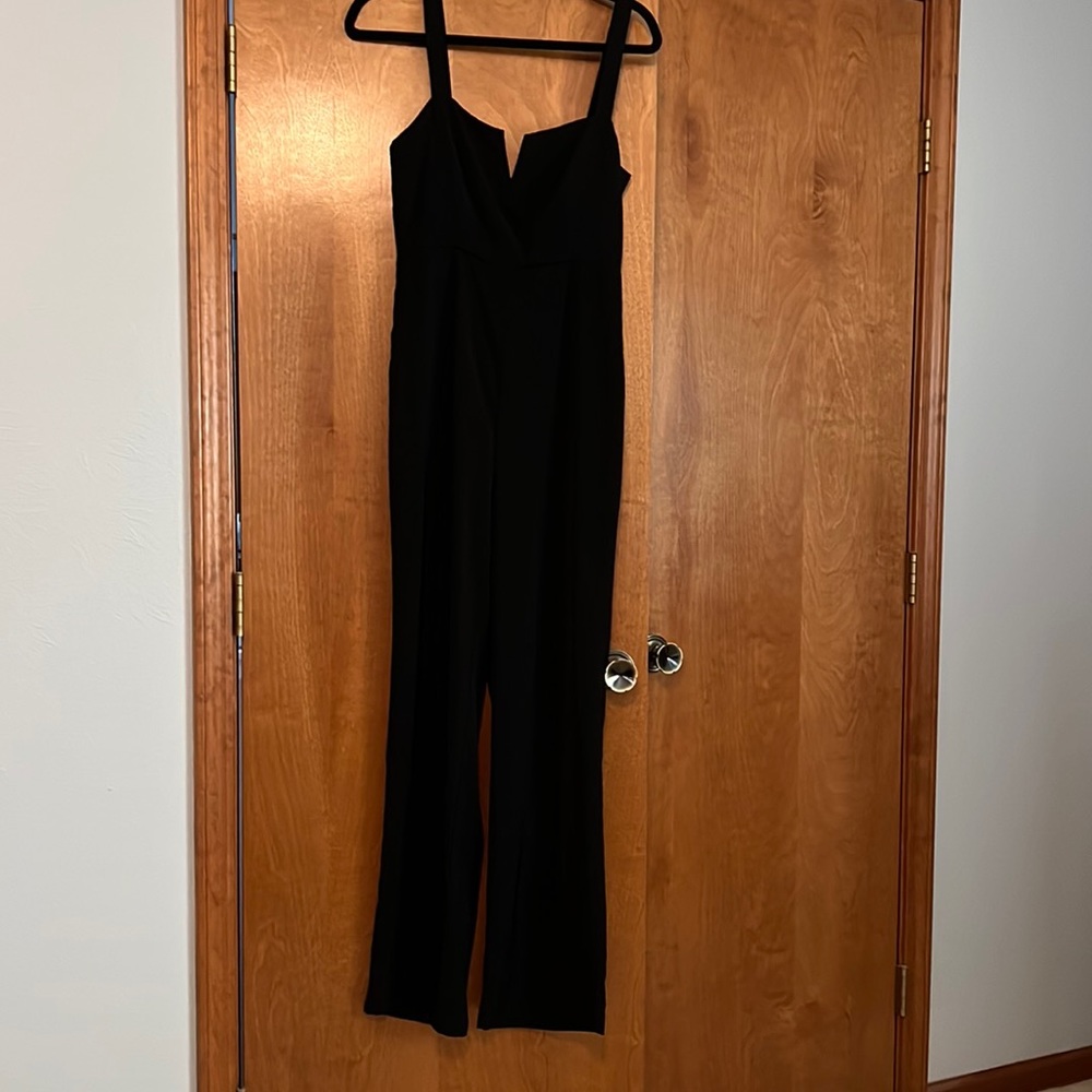 “About us” black jumpsuit from Revolve